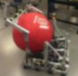 Robot carrying a red exercise ball